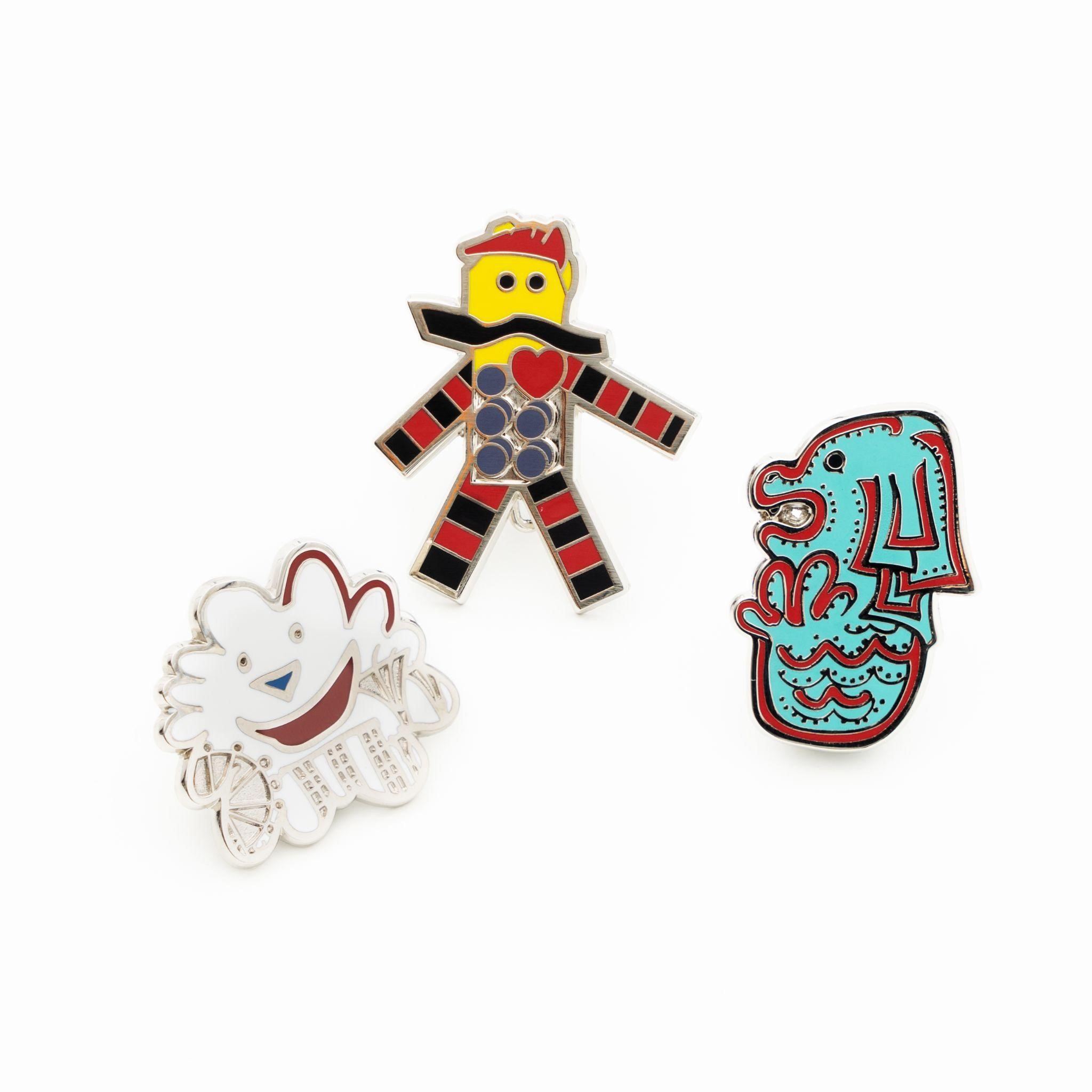 Enamel pins on white background, from left to right, Sunnie, Bricko and Whaat 