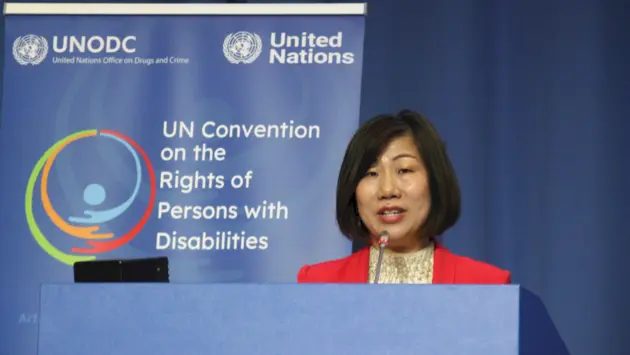 Photo of Ku Geok Boon, CEO of SG Enable, giving a speech at UN Convention on right of persons with disabilities.