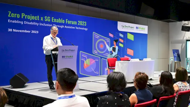 Photo of Michael Fembek, CEO of Zero Project, giving a speech at Zero Project x SG Enable Forum 2023.